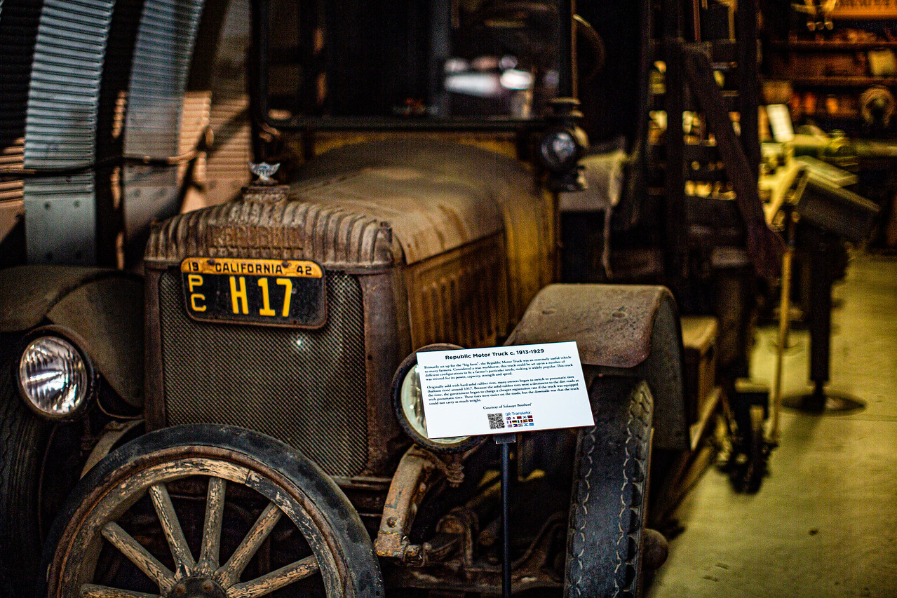 A photo of a QR Translator display in front of an exhibit called Republic Motor Truck